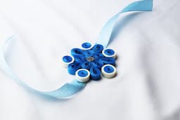 Blue Blossom Quilling Rakhi ( 12 Pcs )